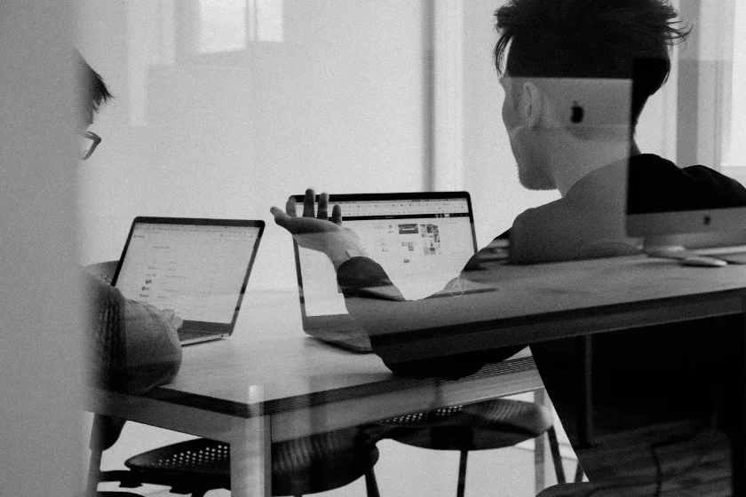 Team meeting around laptops